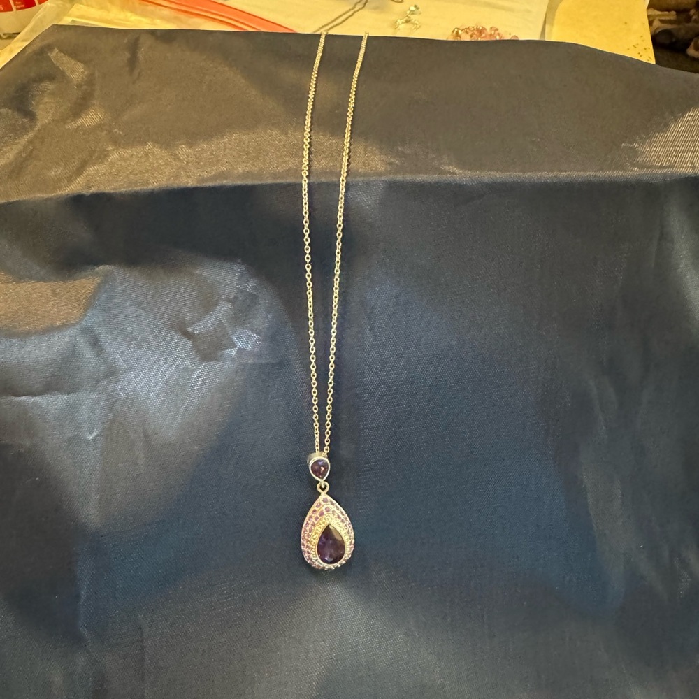2 costume jewelry necklaces with magnetic closure. Both 9-10”. Both purple